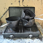 necessary tools in a foundry - little kettles to melt wax